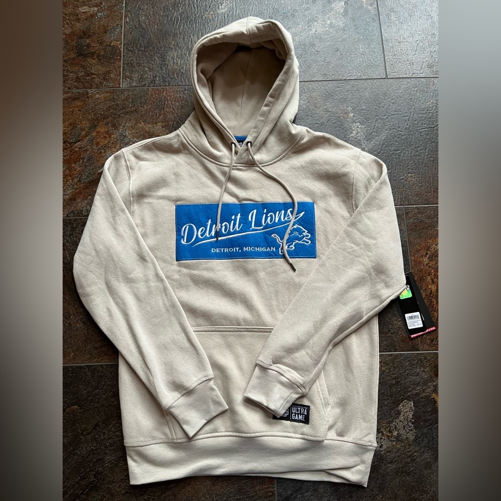 New Ultra Game Official NFL Detroit Lions tan blue pull over hoodie. Medium